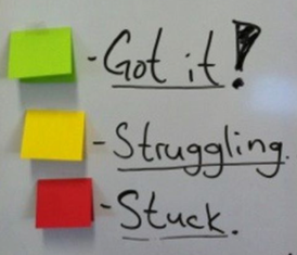Use colored sticky notes as a signal to teacher.